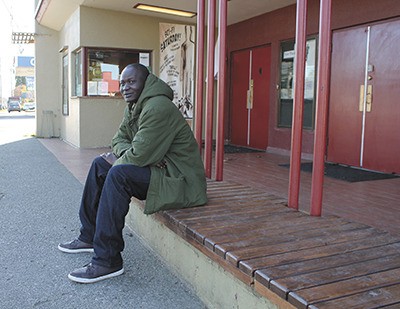 Peter “Deng Deng” Dut sits outside the Vashon Theatre