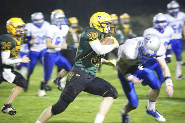 Pirate senior Josh Lawson moves the ball for Vashon in the second quarter of Friday's home football game with South Whidbey.