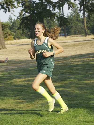 Sophomore Maddie Groen drives for the finish line and a bit of shade at the end of the 5K cross country race.