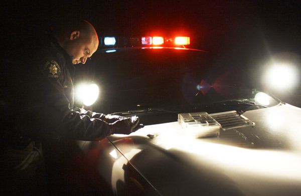 Sheriff’s Deputy Mark Brown tests marijuana he confiscated from a vehicle on Friday night.