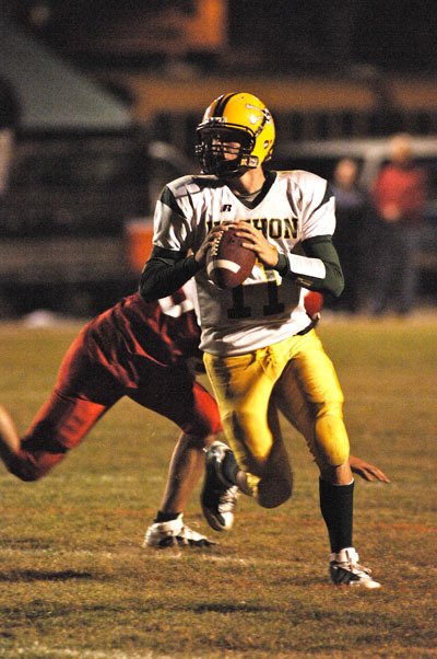 Quarterback Quinn Holert prepares to pass the ball.