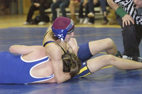 McMurray wrestler Zhenya Bergman squeezes Michael Brown of Mountain View on the way to a pin in the Feb. 8 middle school meet.