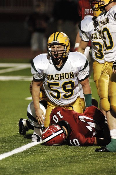 Senior Kyle York revels in the moment after a tackle.