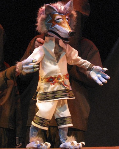 A wolf puppet is part of the fun for “Tears of Joy.”