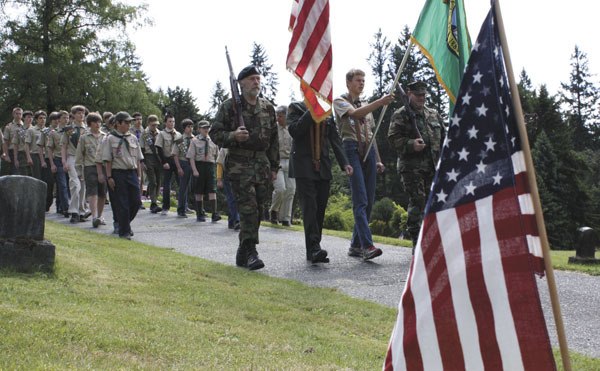 Boy Scout Troop 294 follows the Color Guard — from left