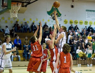 Charlie Hoffman goes high above the Orting Cardinal defenders on Tuesday.