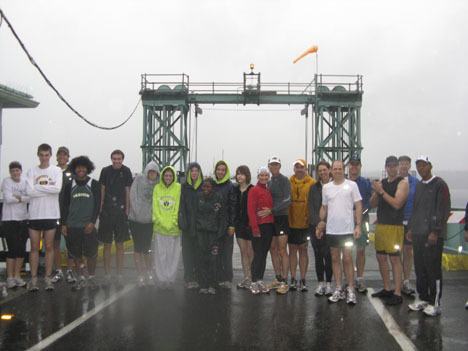 The runners who took part in the dock-to-dock run pose for a picture at the north-end ferry dock.