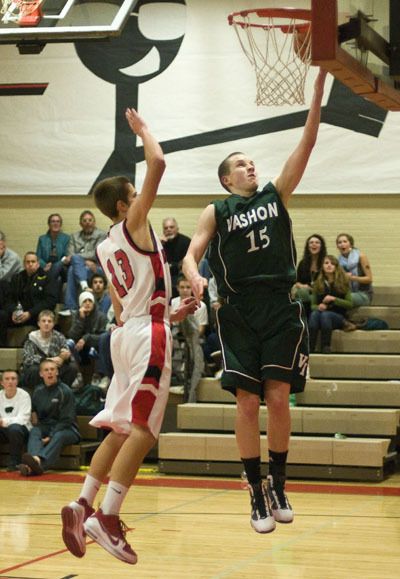 Elias Weston lays the ball in the basket against Port Townsend.