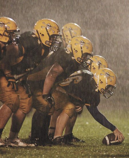 The Pirates’ offensive line gets set for a punt late in the game.