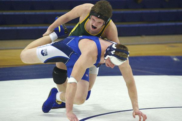 Preston Morris starts the takedown for a 6-4 overtime decision over Cascade Christian’s Tommy Kennedy in their 215-pound match.