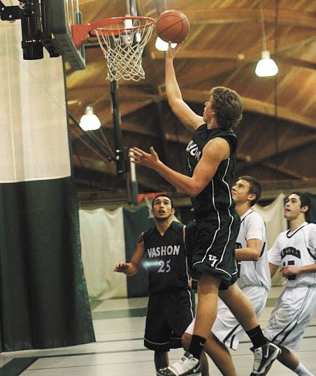 Hamzah Griffin goes up for a shot in the fourth quarter of Tuesday’s game against Charles Wright Academy. Adrian Arceo (25) looks on. The Pirates beat the Tarriers