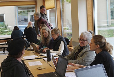 Trained volunteers assist islanders with signing up for health insurance on Saturday at Chautauqua Elementary School.