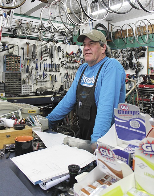 Vashon Island Bicycles owner Jeff Ammon at the shop last week. Ammon says the shop may not be open past the end of the month.