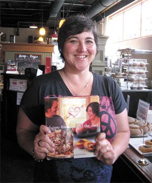 Shauna James Ahern shows off a copy of her latest book.