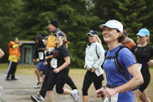 Islander Kelly Straight and other runners are all smiles at the beginning of the Vashon Ultramarathon.