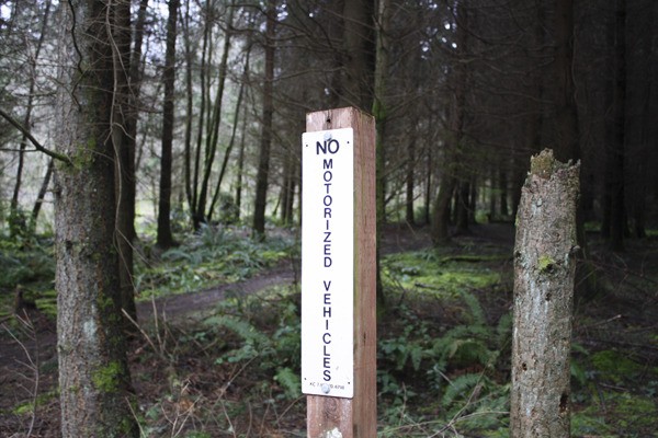 County officials hope that signs posted near the newly aquired natural area will discourage dirt bikers from riding there.