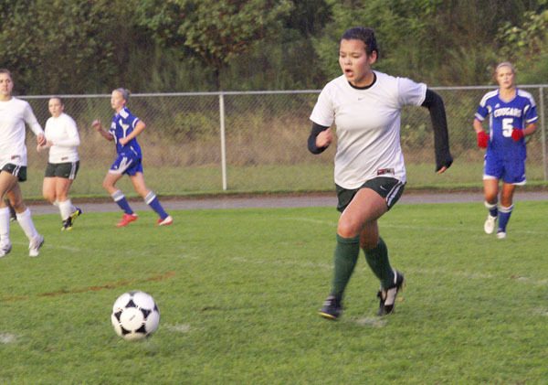 Lena DeGuzman moves the ball near midfield as the Pirates take control of Tuesday’s final home soccer game against Cascade Christian.