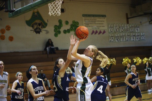 Anya Quig puts up the first two points of Vashon’s home game against Auburn Adventist last week.