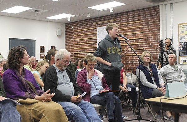 Vashon High School student and debate team member Sam Cushing asks school board candidates at the Thursday