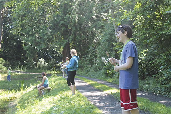 Campers at Camp Goodtimes enjoy fishing at the Sportsmen's Club.