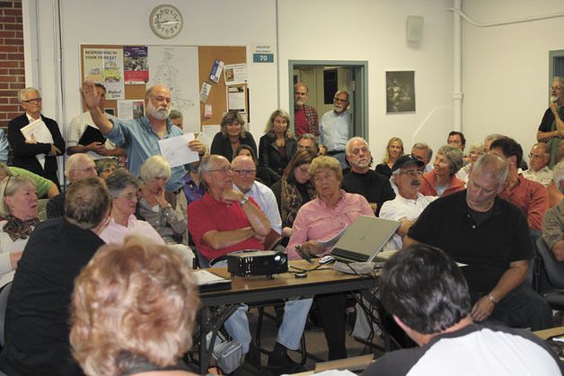 Rick Wallace raises his hand to make a comment at the King County Landmarks Commission's hearing on Thursday.