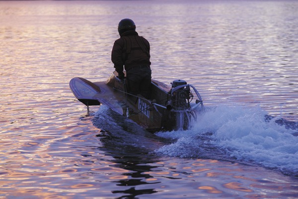 A lone hydroplane driver heads off into the early morning.