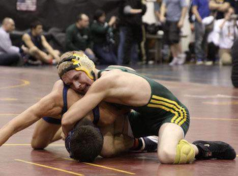 Senior Sam Chapman pinned his unranked opponent last Thursday. Above