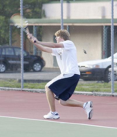 Zach Barker returns a volley on his way to victory in the team’s final regular-season match against Charles Wright Academy. Barker will compete tomorrow in the Nisqually League tournament.