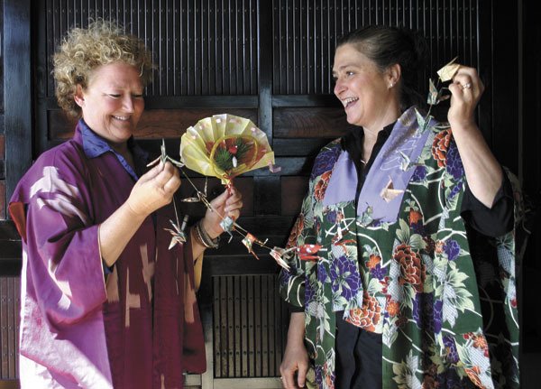 Bonnie McAllister and Susan Lofland are two of the auction's organizers.