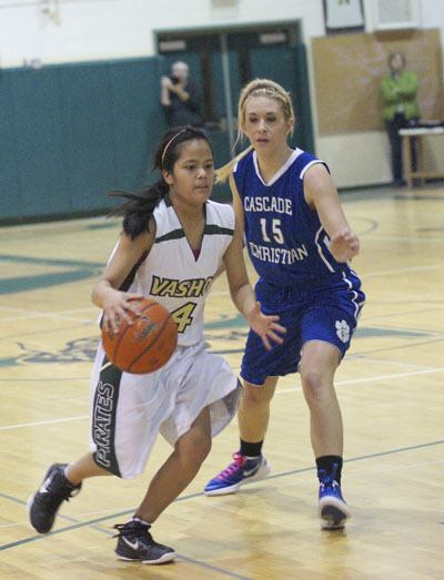 Pirate sophomore Tianna Koenig drives to the basket past Cascade Christian senior Delaney Roosendaal late in Friday's basketball game.