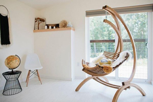 A unique swing-chair in the interior living space of a Lodges on Vashon unit.