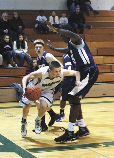 Ian Stewart encounters traffic as he drives under the basket early in the Pirates’ 70-49 win over Christian Faith.