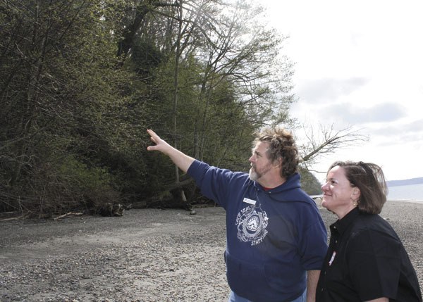 Rick Taylor and Bridgett Chandler survey the bluff that’s now protected