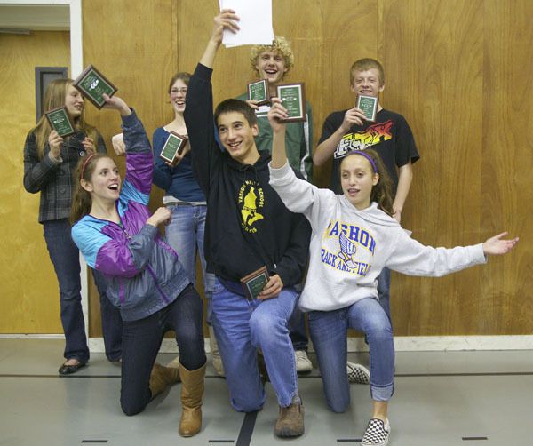 Cross country award winners show off some of their hardware at Wednesday’s banquet. Pictured from left are Ella Maierhofer