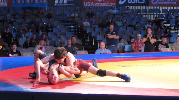 Chase Wickman pins at opponent on his way to becoming the Double Champion