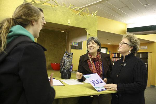 Volunteers Terri Colello (middle) and Bonnie McCallister (right) chat with junior Kyle Gagner and senior Savannah Krug about their college plans at the OWL’s Nest during lunch at VHS.