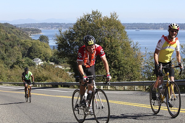 Participants crest a hill during last weekend's Passport to Pain cycling fundraiser for the Vashon Island Rowing Club.