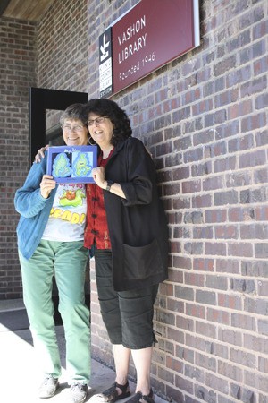 Vashon librarian Rayna Holtz and Ann Leda Shapiro hold a copy of “My Island.”