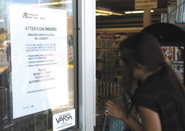 A VARSA sticker is added under a warning to minors at Vashon Market.