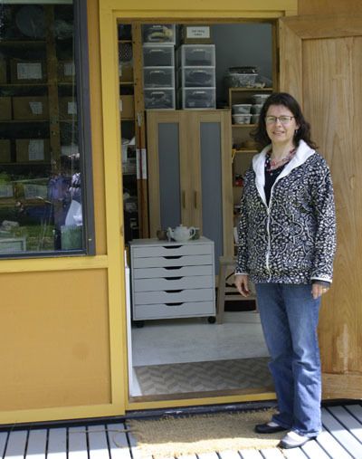 Lidunn Øverdahl Cain stands at the doorway to her studio outside of her home on Cemetery Road. Her husband and father built the studio last winter. The light-filled studio is testament to her practical nature. The left side serves as her architecture studio while the right serves as her sewing space for Buddhist robes and cushions.