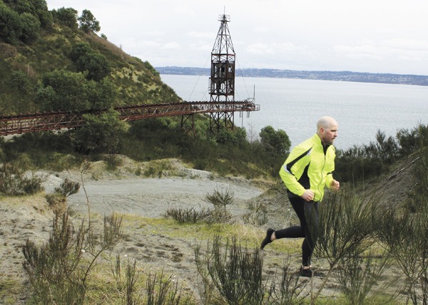 Kevin Kim-Murphy goes on a run at the former Glacier Northwest mine site on Maury Island