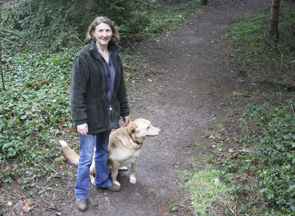 Beth Bordner with her dog Tiber at Island Center Forest