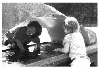 FUN WITH ART: Malcolm and Tamsen Henry enjoy an art piece for Vashon Allied Arts’ annual art auction. The piece is “Dark Tarn