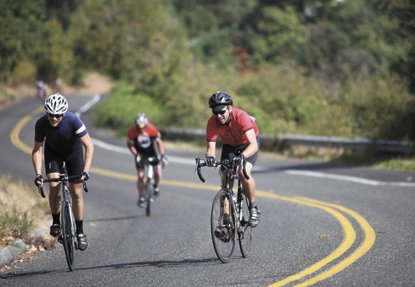 A few riders make their way up Gold Beach Drive