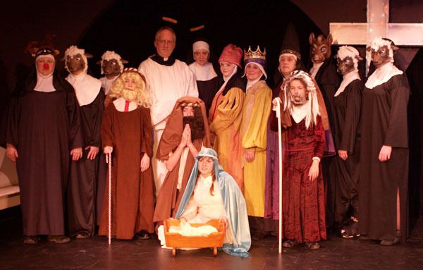 The cast of “Nuncrackers” poses for a silly living creche during one of the scenes in the show.