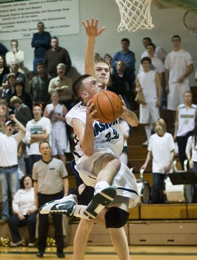 Matt Kerns sails through the air for two points during Dec. 18’s home game against Cascade Christian.