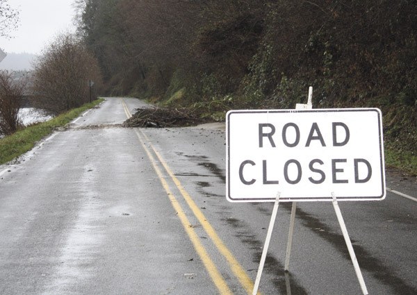 File Photo Signs such as this one at Dockton Road last winter could become more common as the county struggles with a declining road services budget.