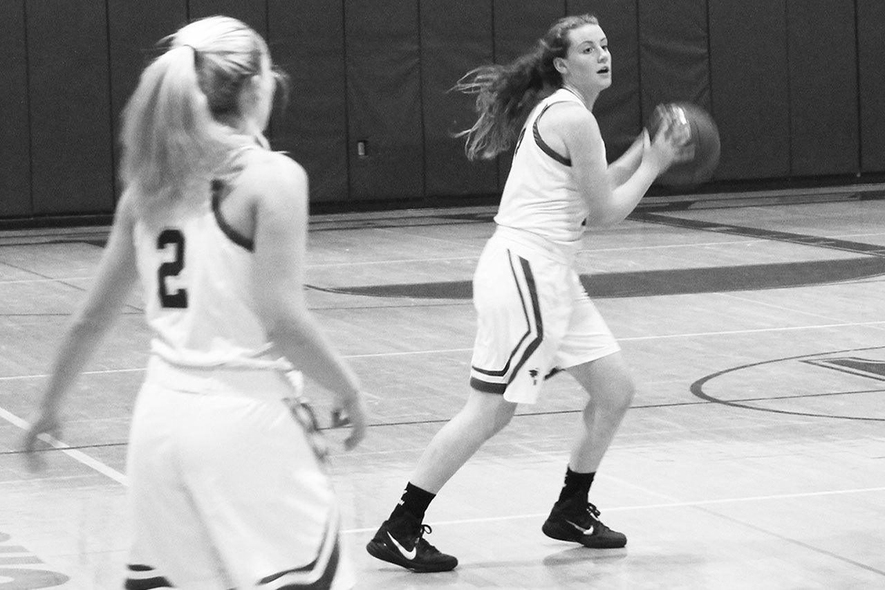 VHS senior and varsity team captain Eva Anderson (right, pictured here at a game earlier in the season) is the girls’ varsity team’s top-scoring player. (Anneli Fogt/Staff Photo)