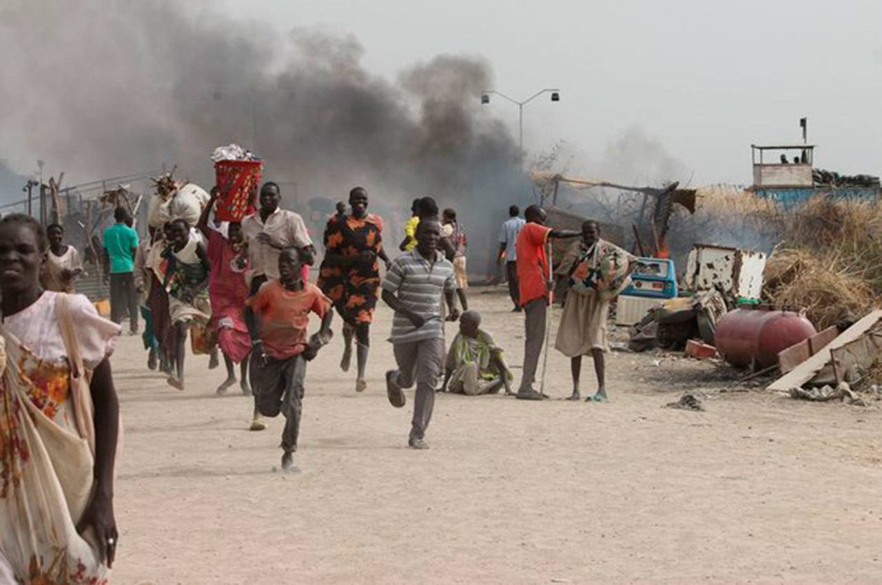 South Sudanese refugees flee a United Nations base while under attack in Malakai last February. (Justin Lynch/AFP/Getty Images)