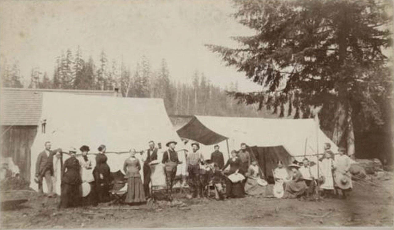 Visitors stand outside their tents during a Chautauqua event at Ellisport in the late 1800s. (Courtesy Photo)